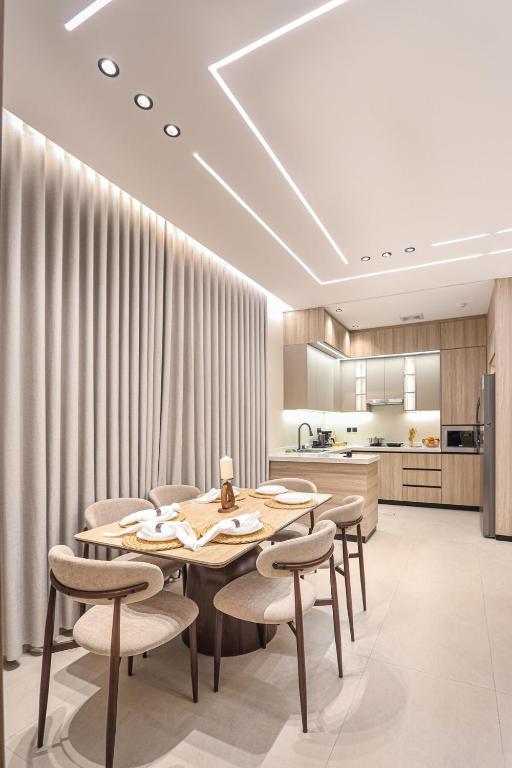 a dining room with a table and chairs at دار المصطفى in Al-Salam