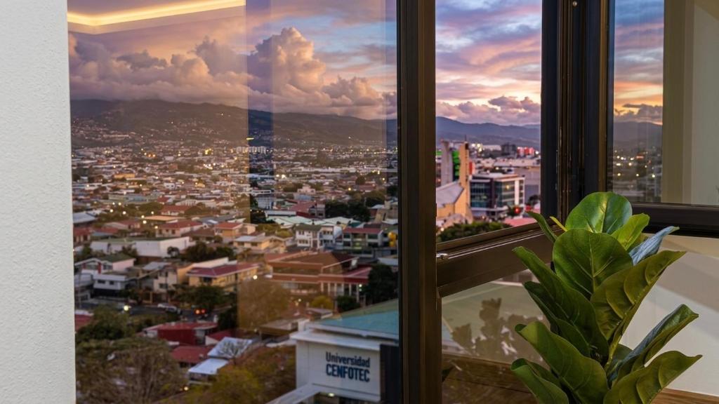 a view of a city from a window at Deluxe Studio in Secrt Escalante AC in San Pedro