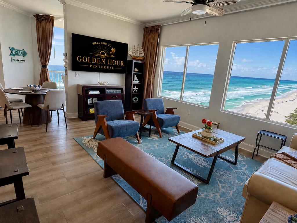 a living room with a view of the ocean at Golden Hour Penthouse - TideWater Beach Resort 2700 in Panama City Beach