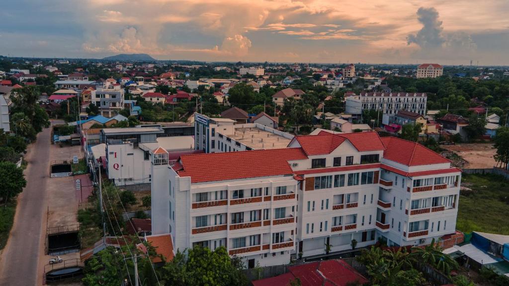 a city with a white building with a red roof at Golden Sanctuary Boutique Hotel in Siem Reap