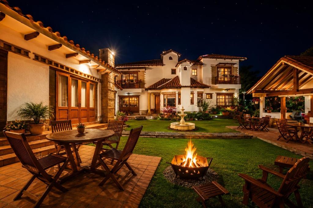 a backyard with a fire pit in the yard at Casa Fiorella in Villa de Leyva