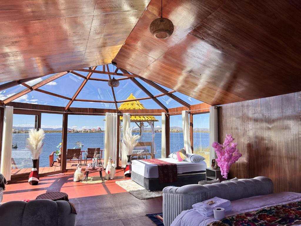 a living room with a large room with a large glass ceiling at Titicaca House Mariela in Puno