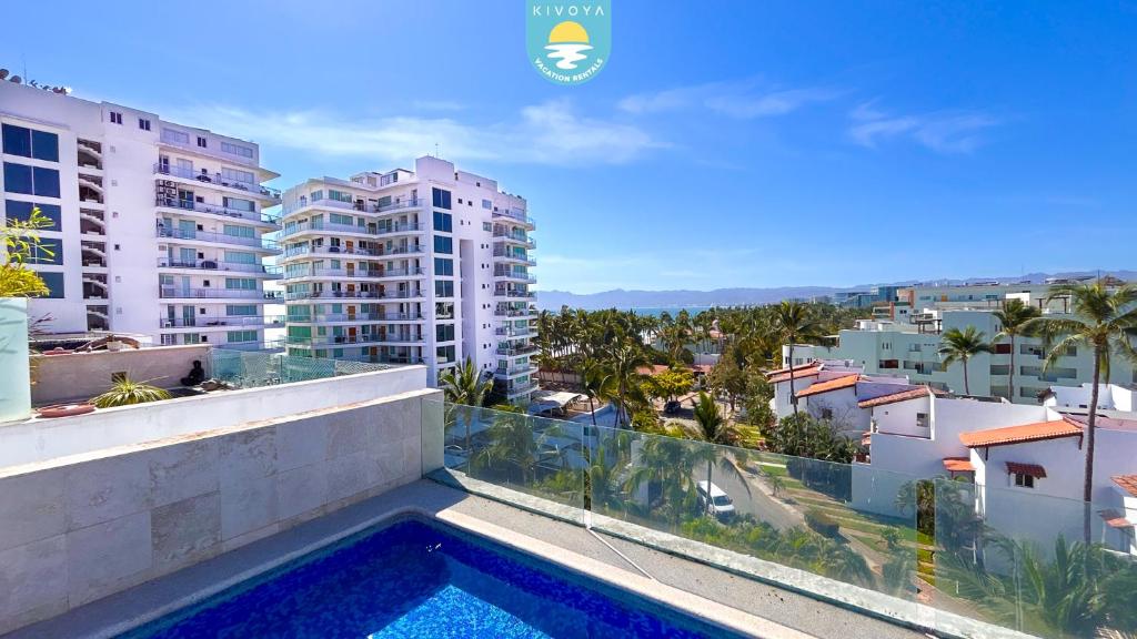 a swimming pool on the balcony of a building at Terra 12 Penthouse Private Shallow Pool & Beach Access in Nuevo Vallarta