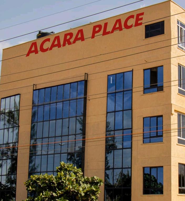a large building with a acaria place sign on it at ACARA HAVEN Kisumu in Kisumu