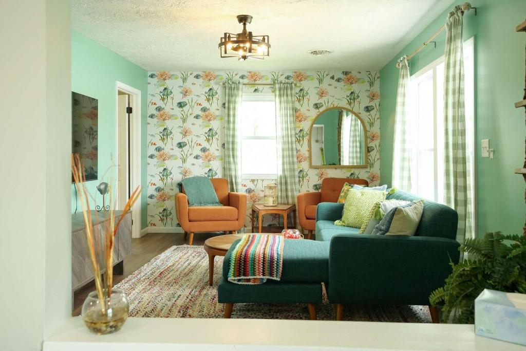 a living room with a blue couch and chairs at Lakefront - Grill - Bunk Beds - Sleeps 6 in Akron