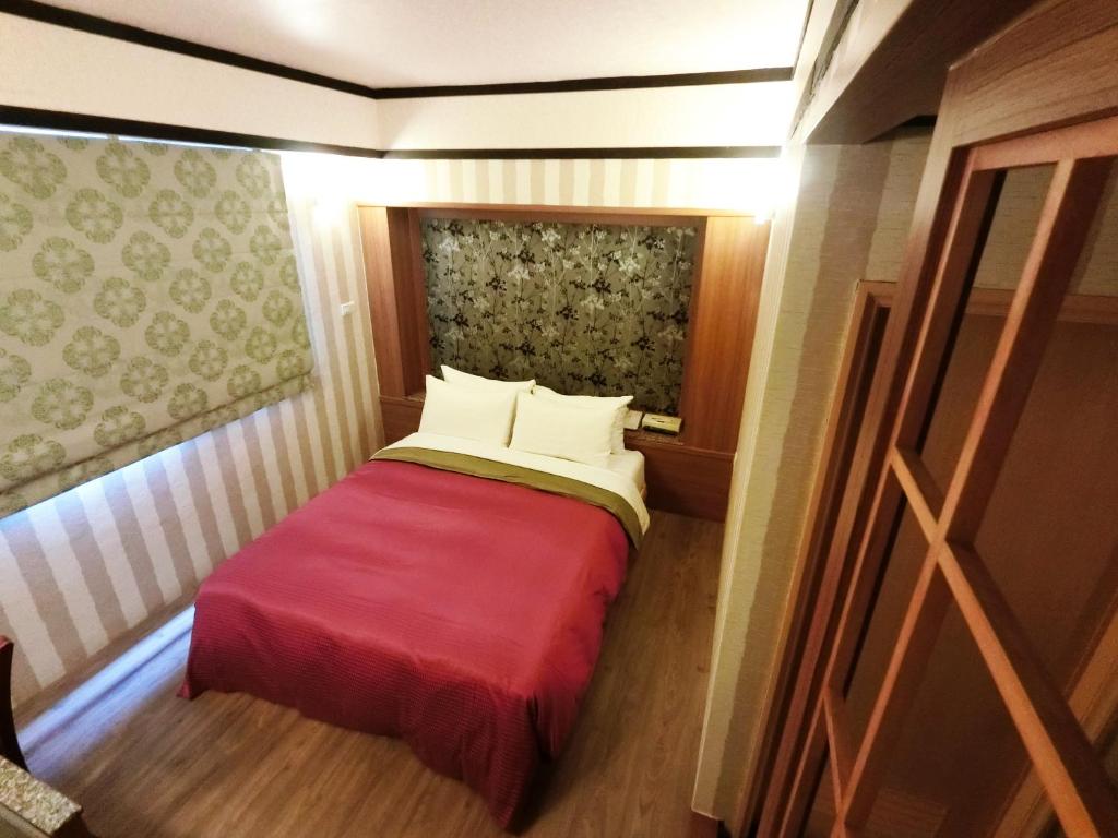 Postel nebo postele na pokoji v ubytování Nice Hotel