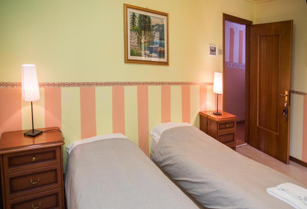 Postel nebo postele na pokoji v ubytování Madonna Della Neve