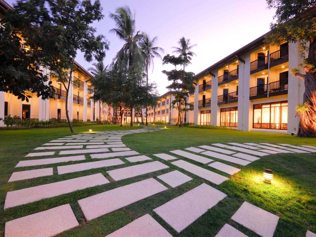 a stone walkway in front of a building at ibis Samui Bophut Hotel in Bophut
