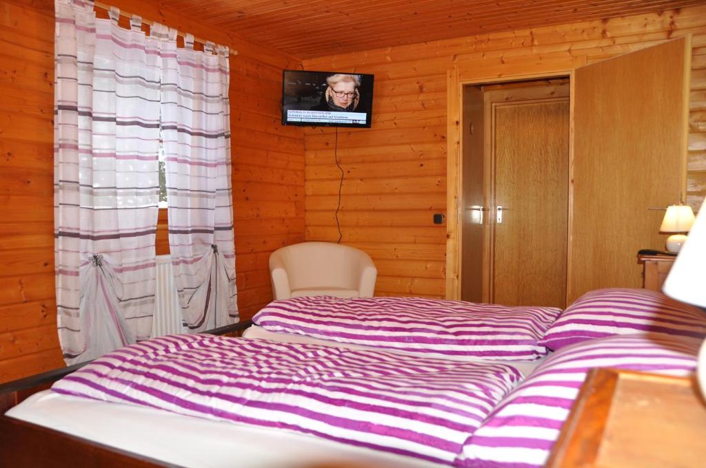 Voodi või voodid majutusasutuse Holzhaus in Hinterstoder toas