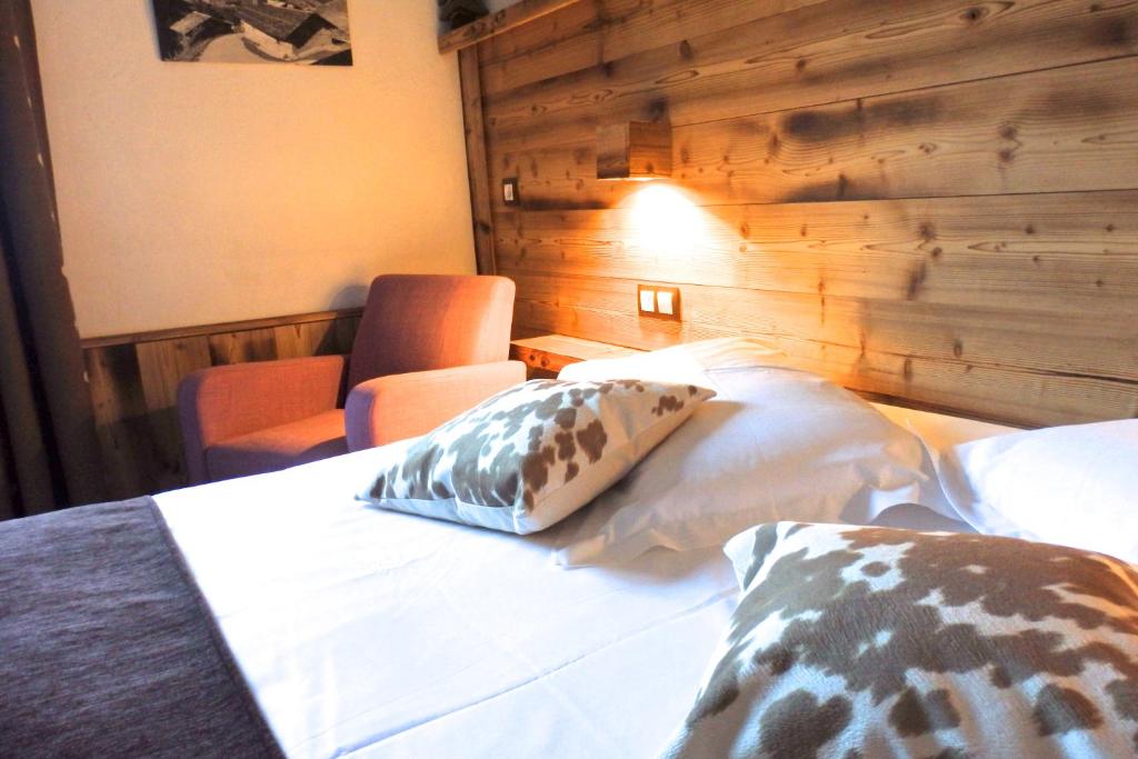Postel nebo postele na pokoji v ubytování Hôtel Viallet