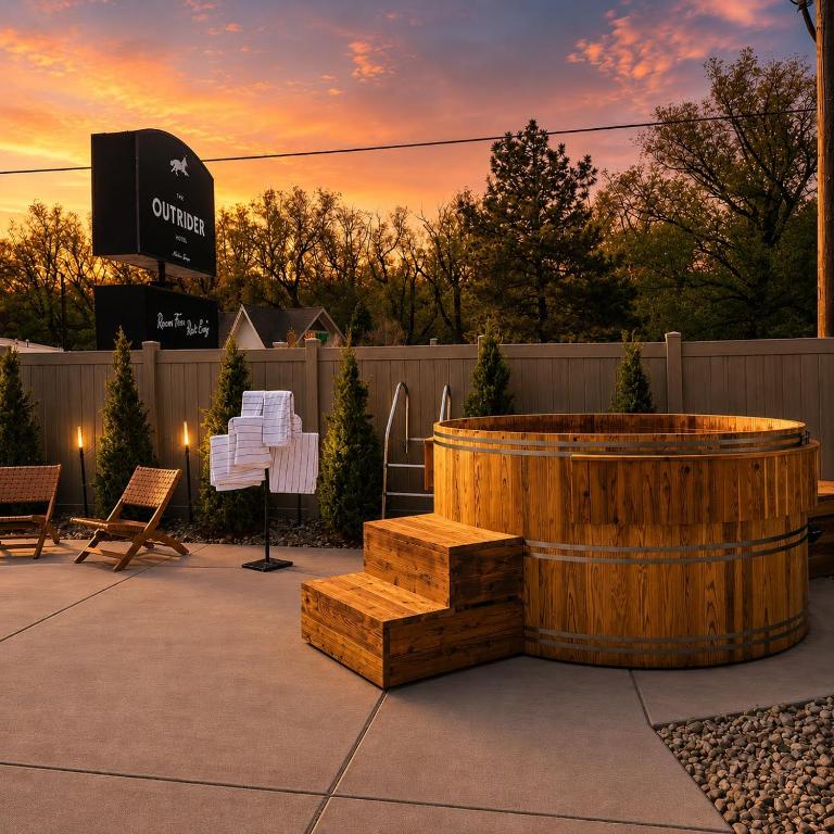a wooden barrel and a fire pit in a patio at The Outrider Hotel in Manitou Springs