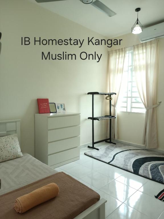 a bedroom with a bed and a dresser and a window at IB Indah Home Kangar in Kangar