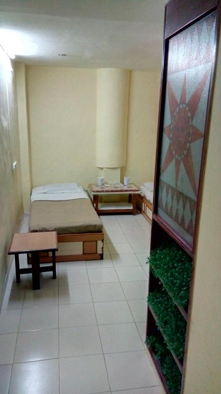 Postel nebo postele na pokoji v ubytování Hotel Damjis