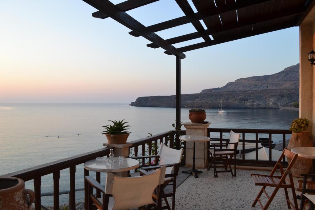 a view from the balcony of a restaurant overlooking the water at Athena Rooms in Kato Zakros