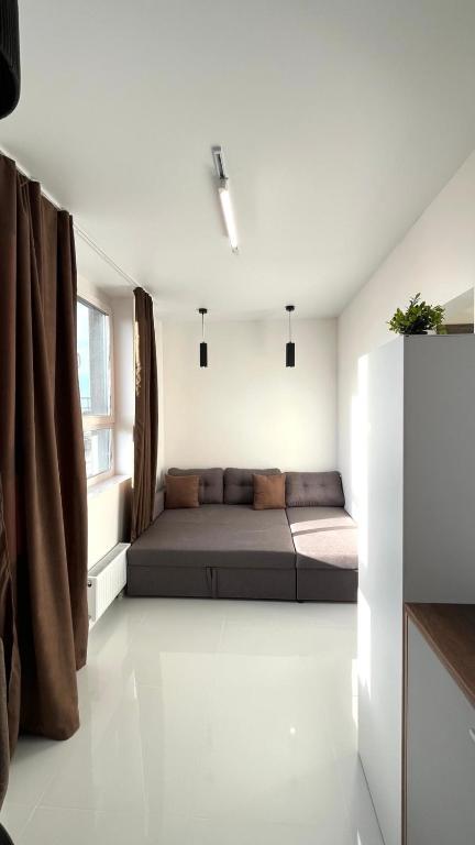 a bedroom with a bed in the middle of a room at ЖК АЯ Студія 1 плюс 1 in Kropyvnytskyi