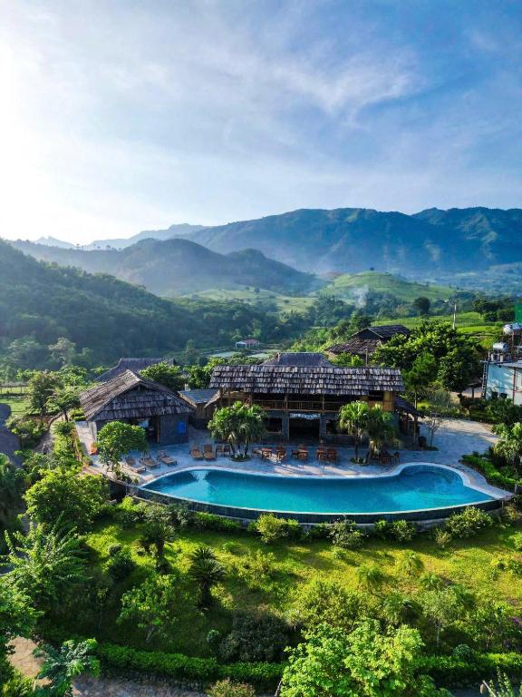 an aerial view of a resort with a swimming pool at Mường Lò Retreat Nghia Lo in Yên Bái