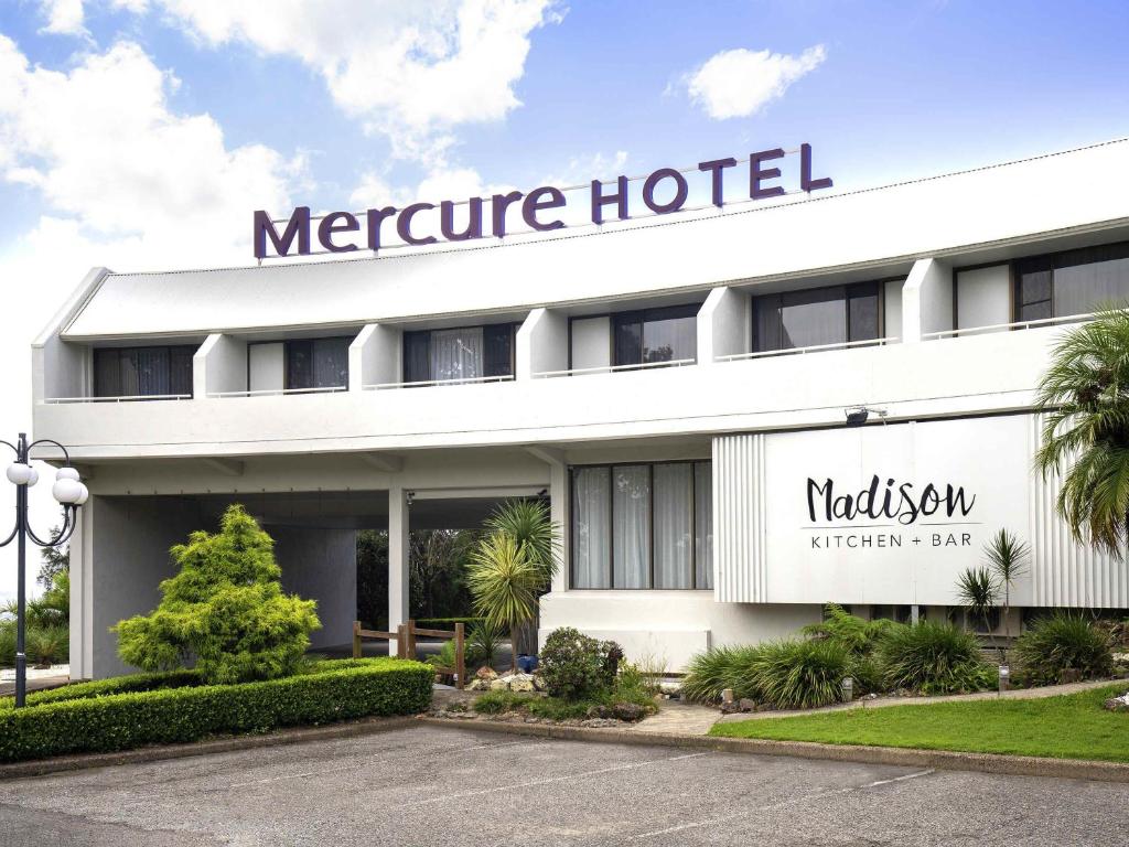 a hotel with a sign on the front of it at Mercure Charlestown in Newcastle