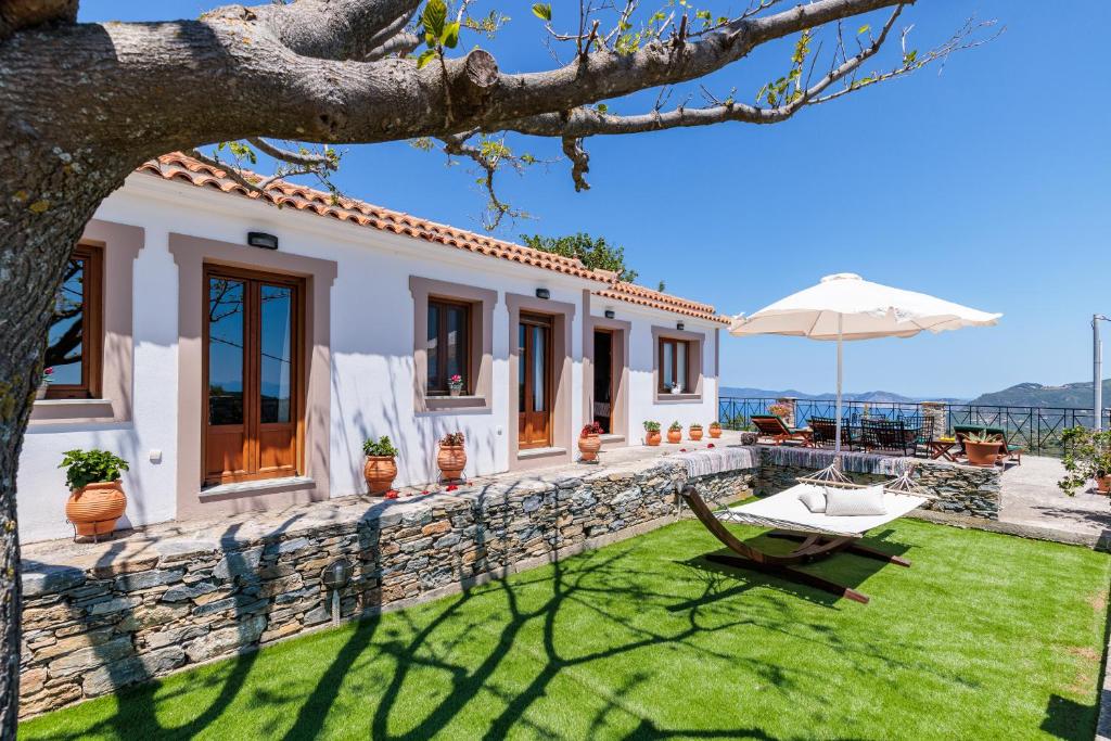 a villa with a view of the ocean at Kastanies Ananias Skopelos in Skopelos Town