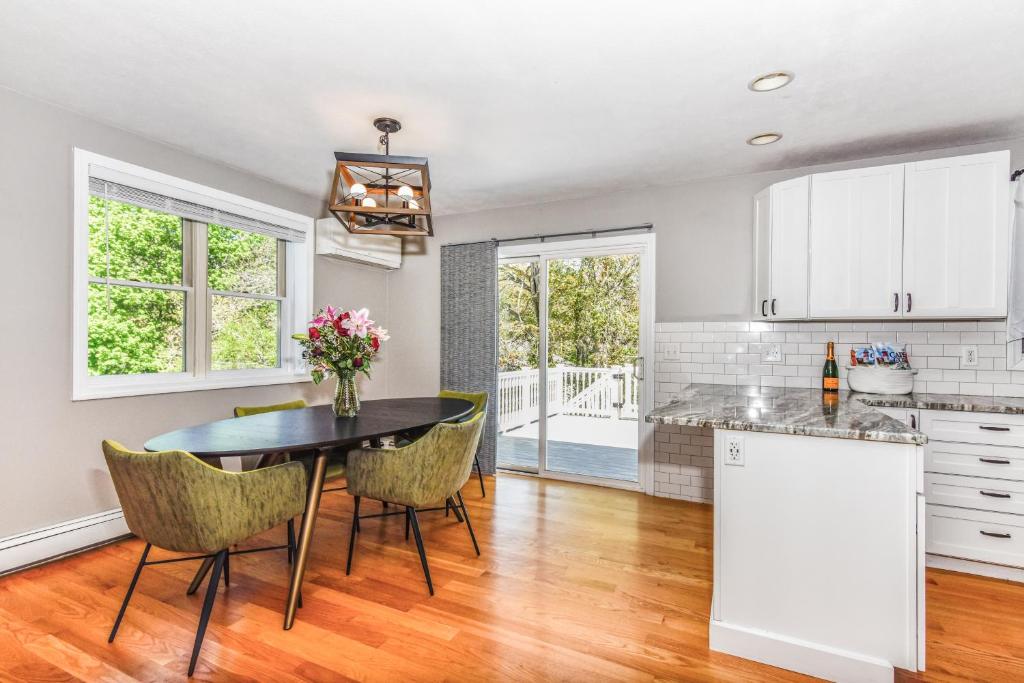 a kitchen and dining room with a table and chairs at Corn Hill Ranch in Falmouth