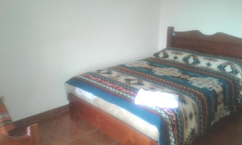 Postel nebo postele na pokoji v ubytování Hostal Curiñan