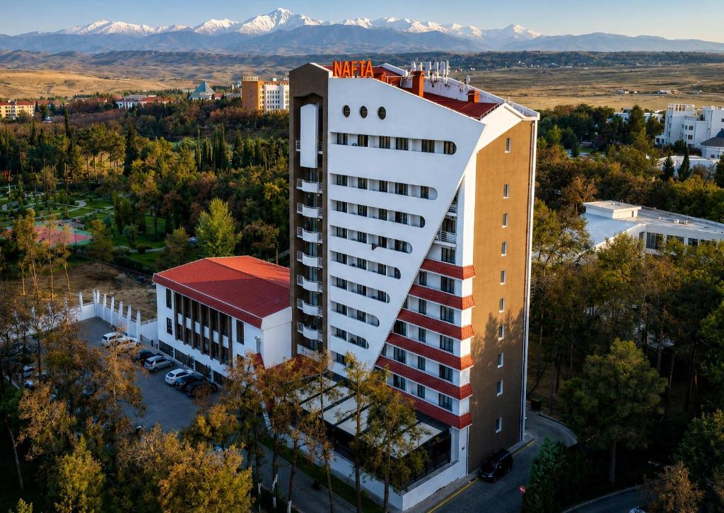 an overhead view of a building with mountains in the background at Nafta Sanatorium in Naftalan
