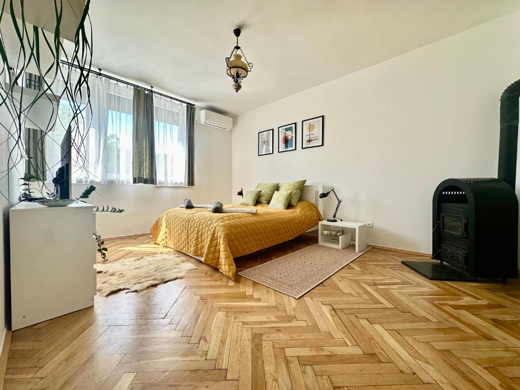a bedroom with a bed and a tv in it at Casa Viola in Balatonfüred