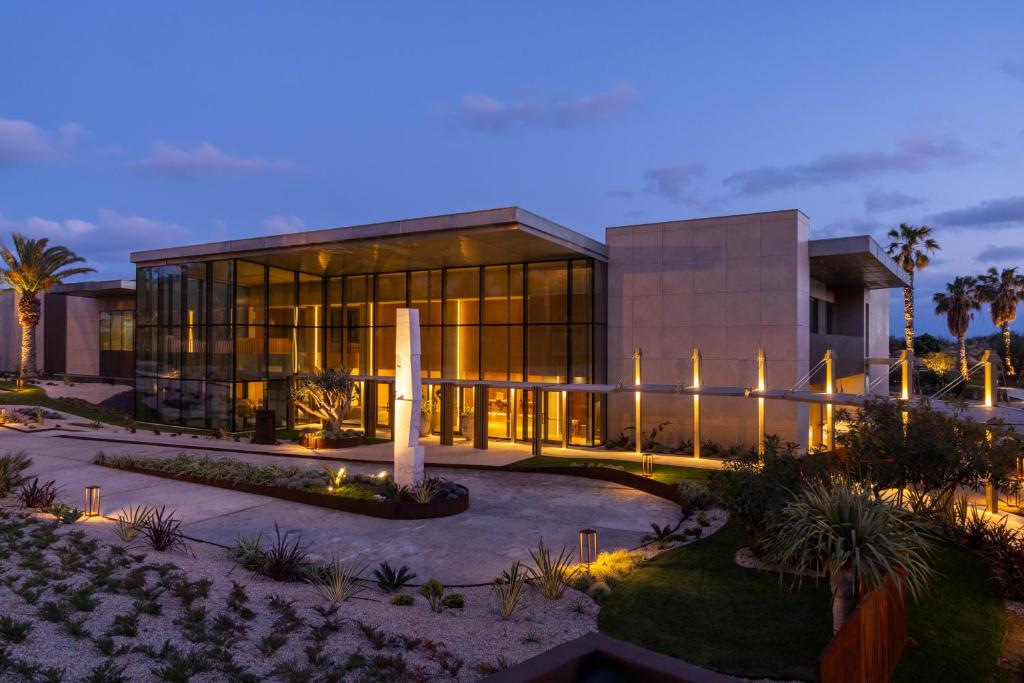 a large building with lights in front of it at Legacy Ithos Boutique Hotel in Porto Santo