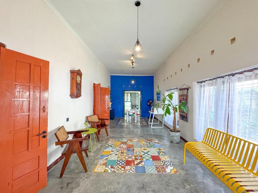 a living room with a couch and a table at ŚamaStay in Yogyakarta