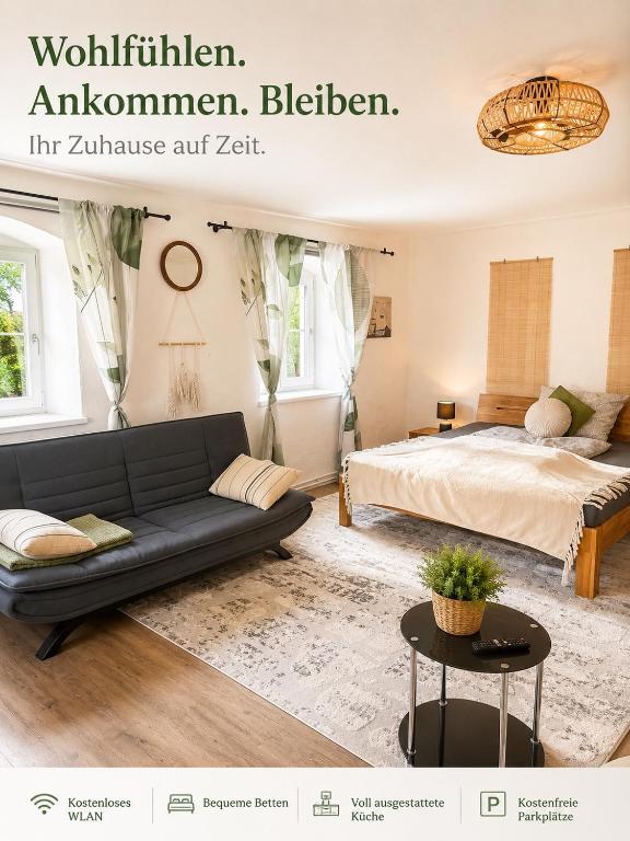 a living room with a couch and a bed at Haus Erna Weitra in Weitra