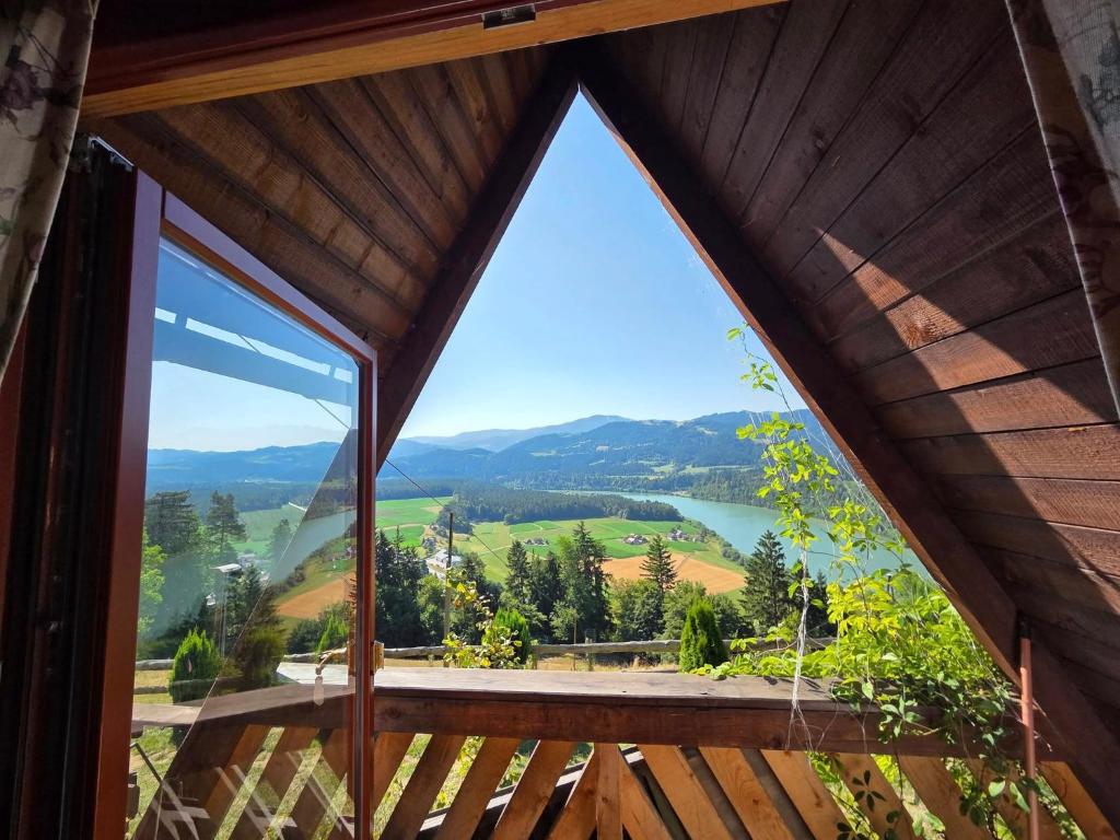 a view from the inside of a room with a large window at Glamping MM in Muta