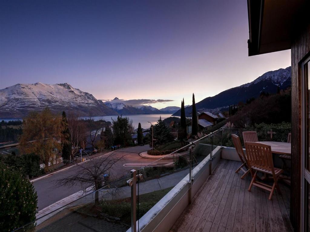 a balcony with a view of a lake and mountains at Breath-taking Views Panorama Terrace in Queenstown