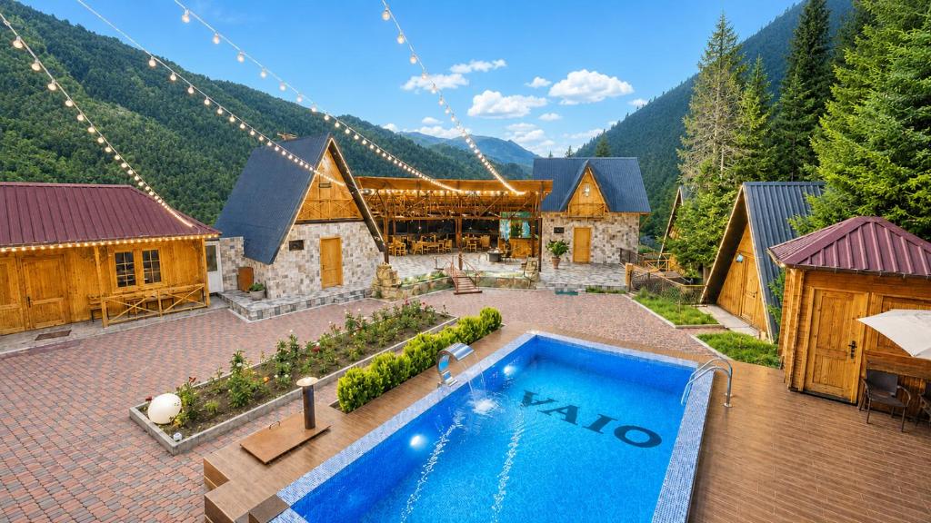 an aerial view of a house with a swimming pool at Vaio Resort in Keda in K'eda