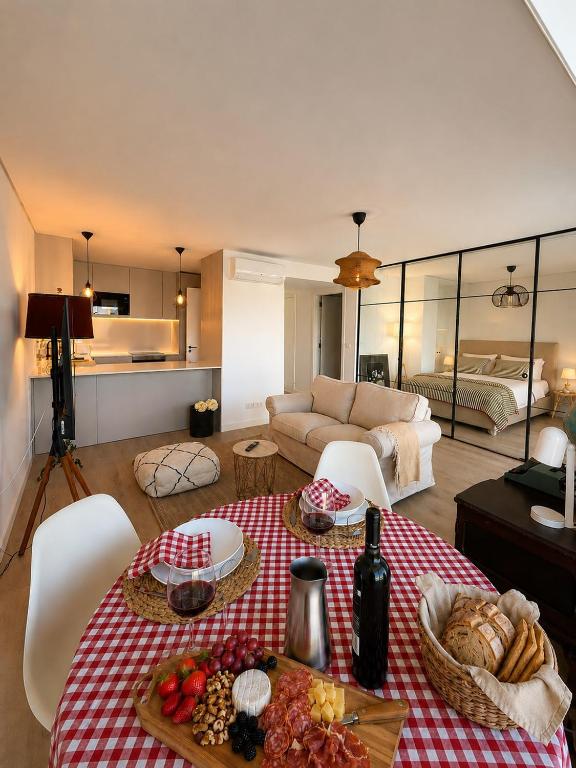 a living room with a table with food on it at Home2830 in Barreiro