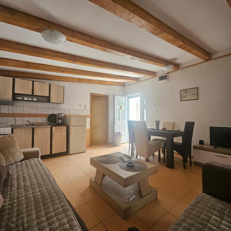 a living room with a couch and a table at Apartman Stepanović 2 in Prijevor