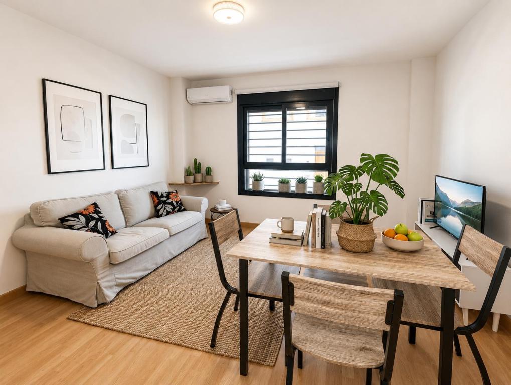a living room with a table and a couch at Brisa del Mar - 2 min playa in El Ejido