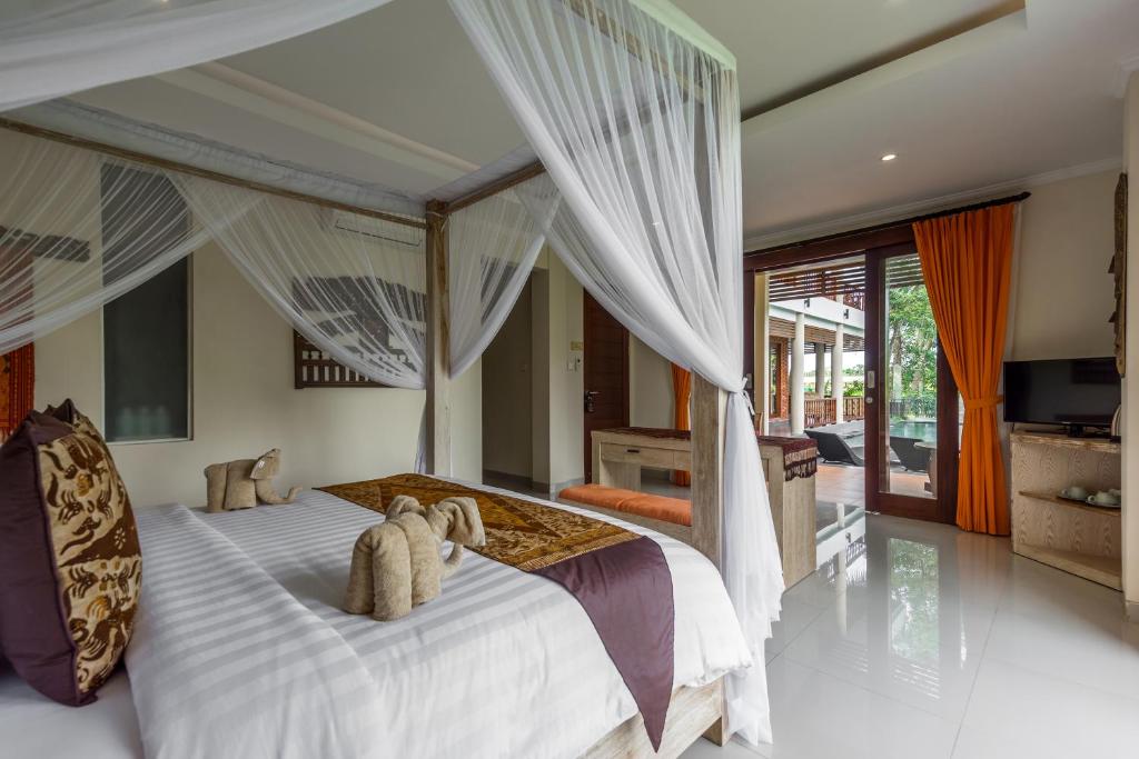 Postel nebo postele na pokoji v ubytování Gefecon Villa Ubud