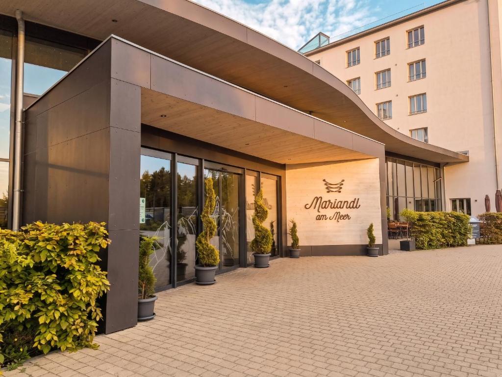 a building with a sign on the front of it at Mariandl am Meer in Binz