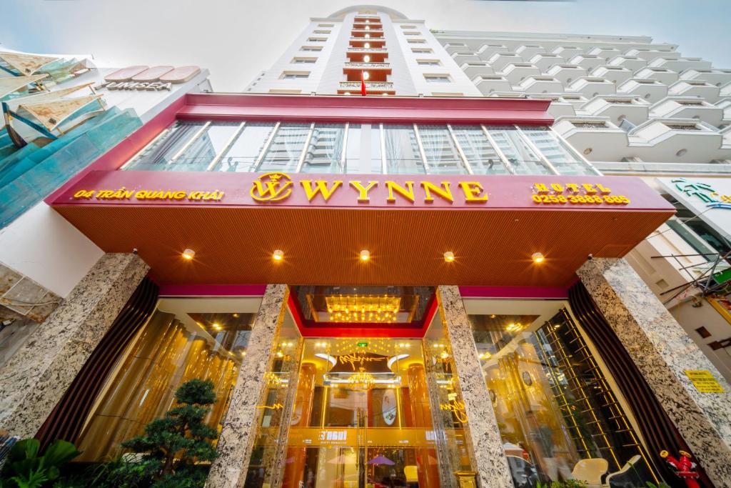 a view of a building with a sign on it at WYNNE Hotel Nha Trang in Nha Trang