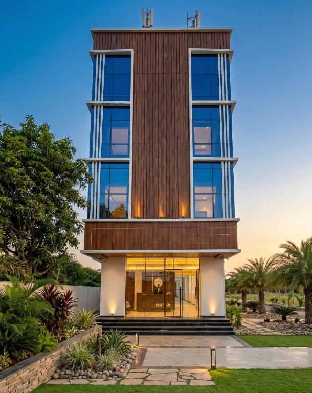 a house with a tower on top of it at Chhapaak Resort in Patna