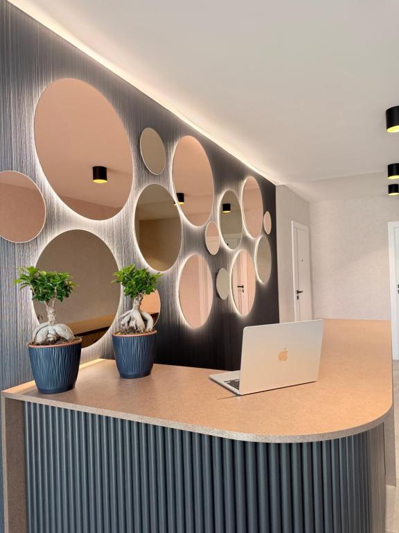 an office with circular mirrors on the wall at Baltic Waves Ex LAZUR in Gąski