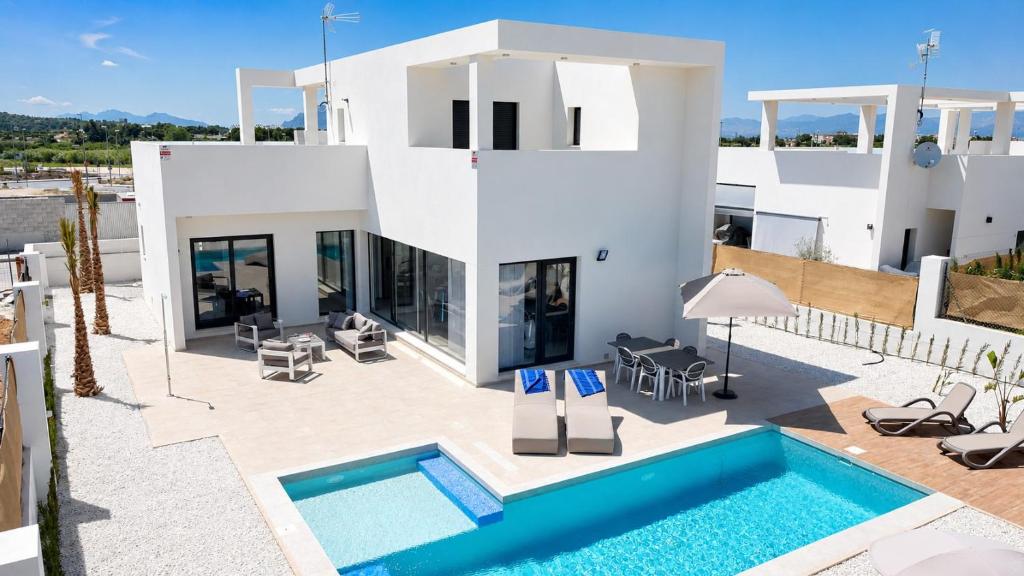an image of a villa with a swimming pool at La Perla Blanca in Benijófar