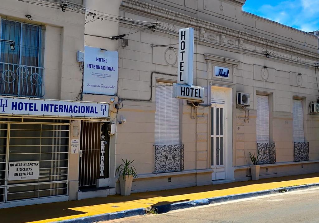 a hotel with a sign on the side of a building at Hotel Internacional in Tacuarembó