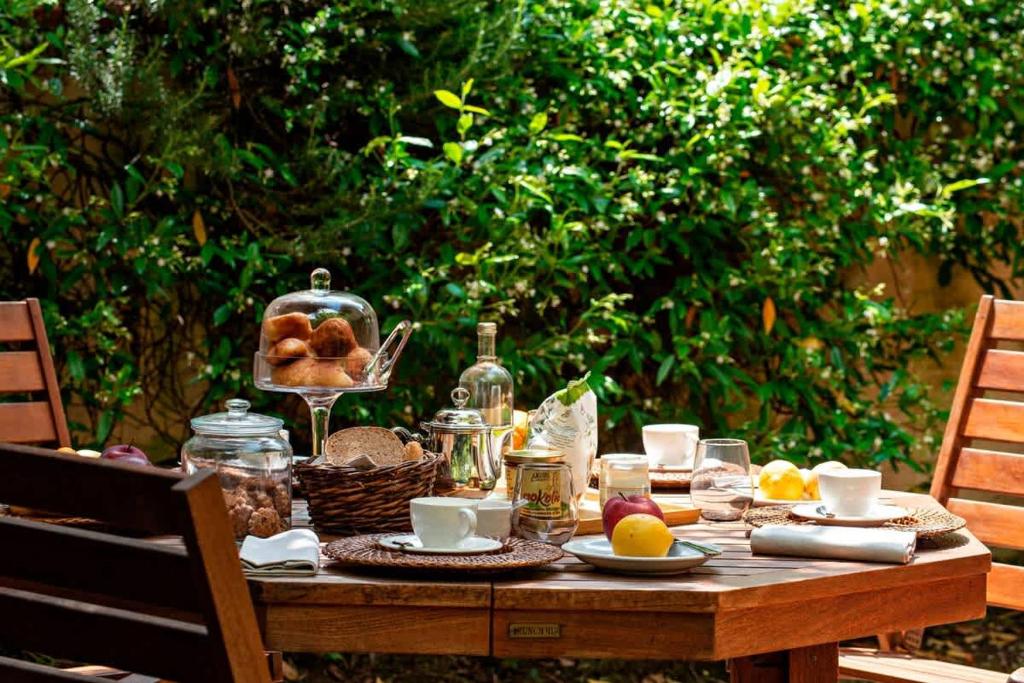 a wooden table with food on top of it at Apartment Panzano in Panzano