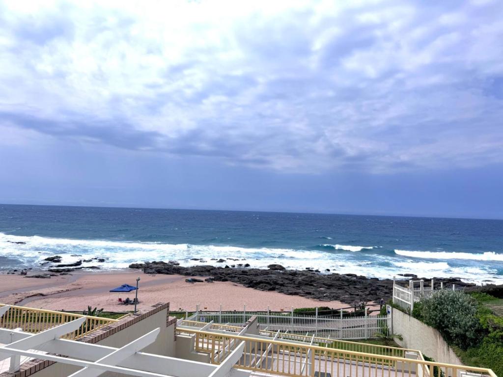 a view of a beach with the ocean at Club 10 Management in Ballito