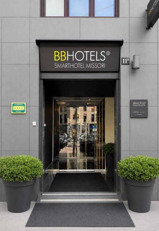 a entrance to a building with a sign for a hotel at BB Hotels Smarthotel Missori in Milan