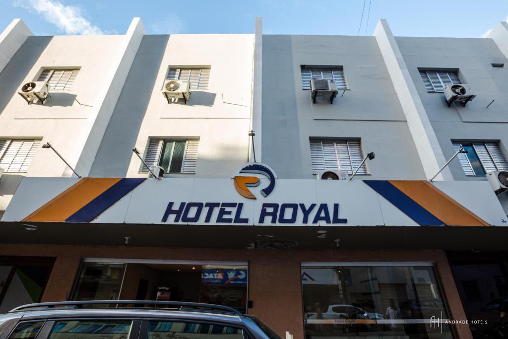 a hotel royal with a car parked in front of it at Rede Andrade Royal in Itabuna