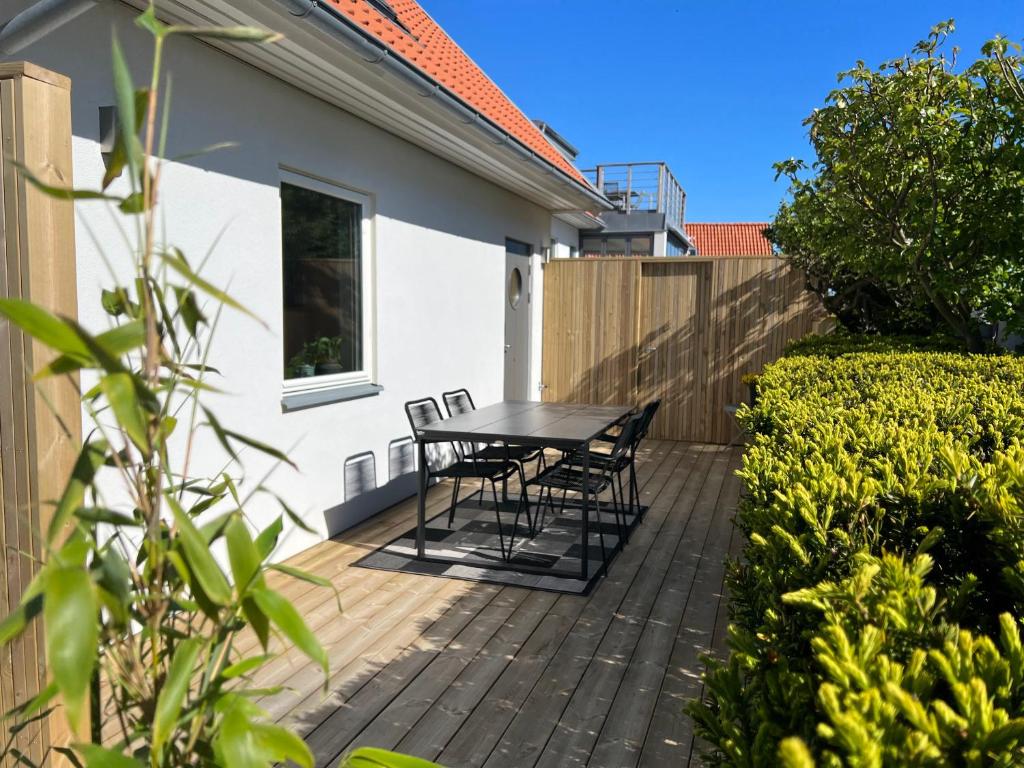 a patio with a table and chairs on it at Seawiew in Helsingborg