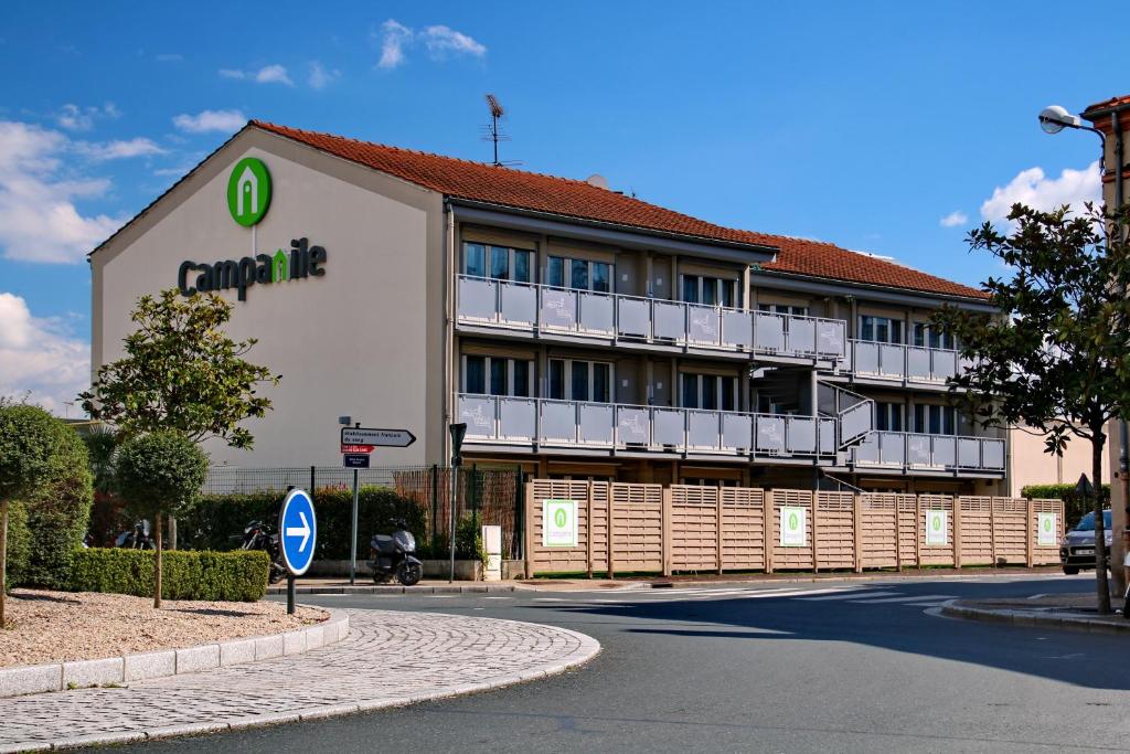 a building with a sign on the side of it at Campanile Albi Centre in Albi