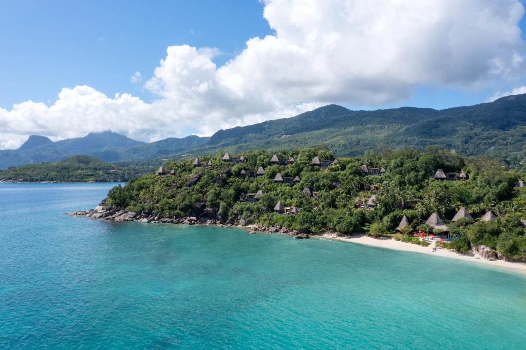 an aerial view of an island in the ocean at Anantara Maia Seychelles Villas in Mahe