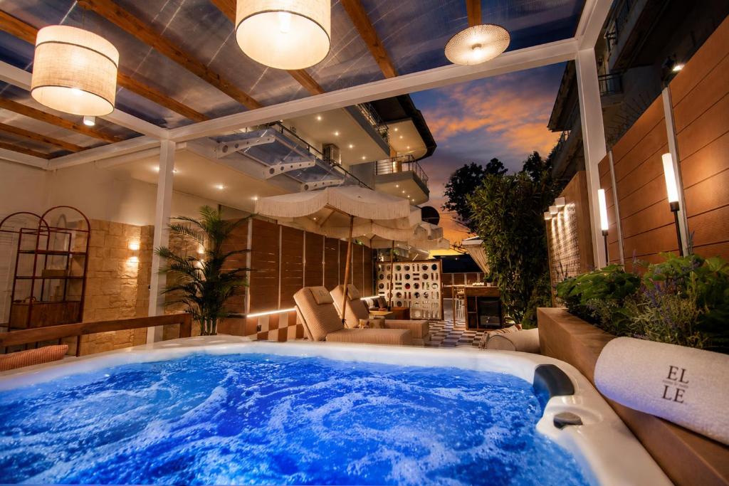 a large blue tub in a living room at ELLE Rooms & Suites in Paralia Katerinis